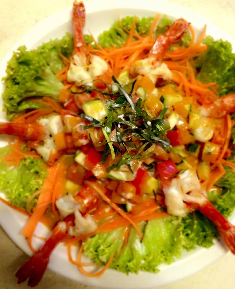 Prawn and vegetable dish with fresh herbs
